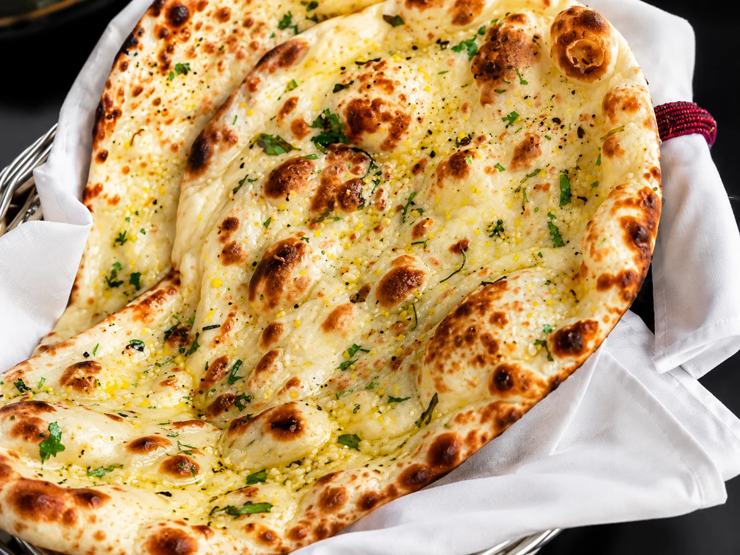 Freshly baked naan and rich Indian curries at New Asian Village, Sherwood Park and West Edmonton